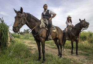 Portrait of Two Riders on Horseback