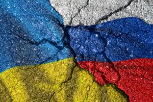Ukraine and Russia flag with cracks