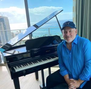 Composer Frank Wildhorn at the piano