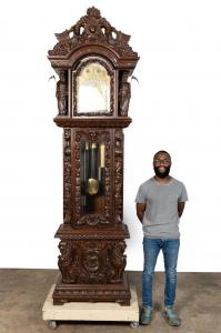 Carved walnut grandfather (or grandfather) clock, made in the last quarter of the 20th century in the Renaissance Revival manner of RJ Horner, with an earlier Tiffany movement (estimated $6,000-$8,000).