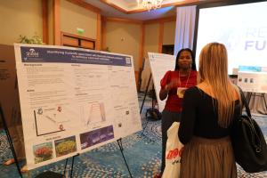 Scientist Bryce Corbett provides insights into her research on trade offs  and thermal tolerance in corals for Shedd Aquarium at Reef Futures 2022