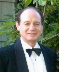 Picture of Greg Nathan dressed in a tuxedo.
