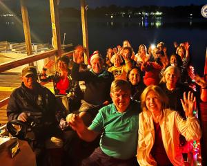 A group of guests ready to sail on The Winter Park Old Fashioned Christmas Cruise