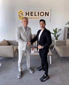 Oliver Von Wolff, form Helion Ventures, shakes hands with M.Hamza, from VMeta3.