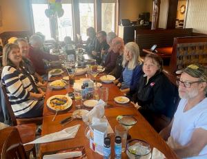Birthday party with about 15 people gathered at table at Northglenn Co Red Lobster Restaurant