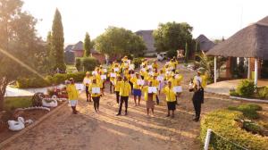 Educators with their certificates outside KwaLanga lodge after graduating.