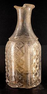 Lots 60-64 are heavy, possibly leaded, cut-glass decanters (lot 1063 shown), 9 inches tall and 4 ¼ inches in diameter at the base. The exterior facet edges have some chips (MB: $250).