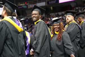 Adult students graduating from Excelsior University