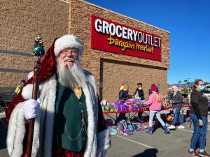 Santa greets young attendees at Project Boon and Grocery Outlet's 2021 Christmas Event