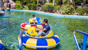 two guests riding bumper boats at Visalia Adventure Park