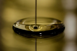 Up close image of pouring fresh, clean oil
