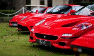 Several red exotic cars that are covered by Veritas Global Protection