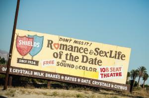 A member of the California Date Growers Association roadside sign.