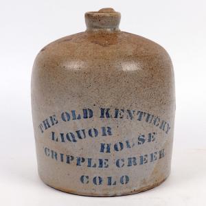 Near-mint, unlisted variant of a Preble (J 32) Old Kentucky Liquor House (Cripple Creek, Colo.) slope shoulder jug, 7 ½ inches tall and very scarce, with a brown glaze on the top ($3,500).