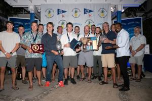Kamal Powell (front row right) shares a moment with the winning team from Callisto Racing at the Appleton Estate sponsored Pineapple Cup - Montego Bay Race Awards Ceremony for 2023. The event was held at the Montego Bay Yacht Club in Freeport, St. James o