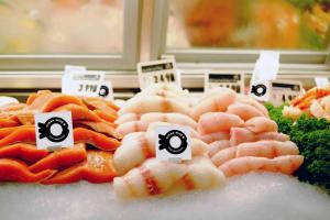 Ocean Wise symbol on seafood display at a fish counter