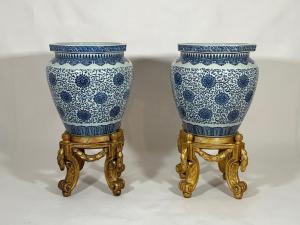 Pair of monumental Chinese porcelain jardinieres on carved giltwood stands, overall 38 inches tall (the jardinieres alone are 24 inches), baluster form (est. $5,000-$8,000).