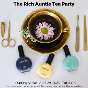 A picture of a tea cup filled with tea and 3 bottles of Sainte Nel vegan nail polish.
