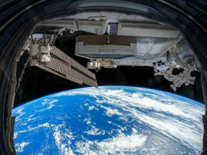 Earth viewed through a window from the International Space Station