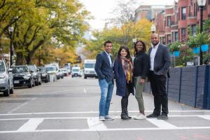 This pictures show the 4 founders of Rooted In - standing in the middle of Newbury Street.
