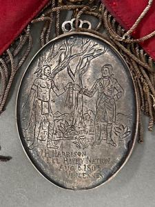 Oval silver metal Peace Medal (Coshocton, Ohio Odd Fellows Sash with William Henry Harrison), with hand-engraved scenes on the obverse and the reverse (est. $1,000-$2,000).