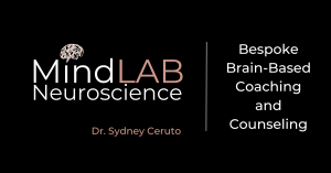 The MindLab Neuroscience Brain-Based Coaching logo features a stylized brain image in shades of Rosy Brown and Pale Dogwood, set against a black background. The word 'Mind' is written in Isabelline, 'Lab' is written in Rosy Brown, and 'Neuroscience' is wr