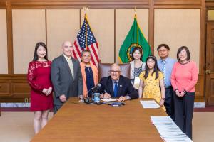 Gov. Inslee signs Senate Bill No. 5000, May 9, 2023. Relating to recognizing contributions of Americans of Chinese descent. Primary Sponsor: Sen. Wagoner