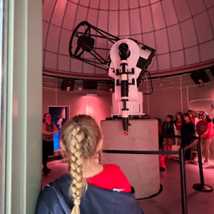 Rancho Mirage Observatory  with people looking at large telescope