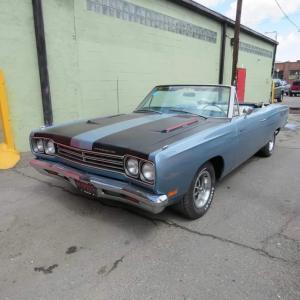 1969 Plymouth Road Runner convertible with a body-on restoration, 383 c.i. engine, and bucket seat console automatic transmission with matching numbers.