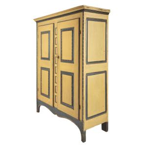 Important, circa 1820 Quebec armoire, the case, doors, cornice, frieze, and stiles all in a strong alligatored yellow paint, giving it the family nickname "Armoire Crocodile" (CA$29,500).