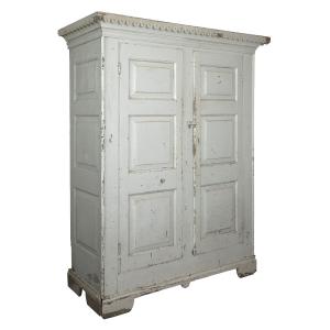 Circa 1830-40 Quebec raised 12-panel armoire in as-found condition, with "waterfall" cornice and bracket base, all in old white paint over the original dark grey (CA$5,900).
