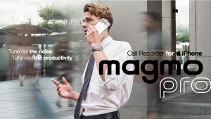 Man standing in a crowd having a telephone call while using Magmo Pro to "tune out" the noise.