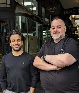 Andreas Lazarou next to Dody Constantinou in Duke Street Arcade, Cardiff