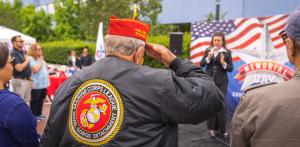 Marine Corps vet salutes the flag during an a cappella rendition of the national anthem.