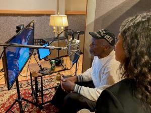 Award-winning Actor Danny Glover on set reviewing the voice-over recording for the Golden Hearted documentary with Director Millena Gay. Photo: HoneyPeach Productions.