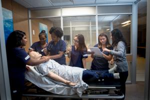 Mercy College Nursing students practice their skills with a simulation manikin at the school's simulation lab.