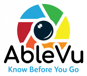 AbleVu logo is a multicolored camera lens with a puzzle piece in the middle. The logo text reads: AbleVu Know Before You Go