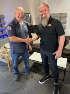 Tim Marriott (LTM Auto Truck and Trailer Repair) and Tom Wiers shake hands during the integration