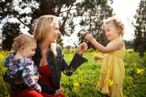 Happy parents with two children through surrogacy
