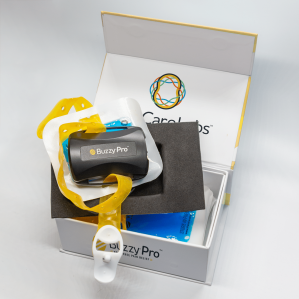 Photo of new Buzzy Pro in box with ice packs and strap