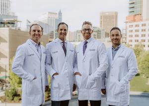 four male physicians in lab coats posing for a photo in Boise, Idaho