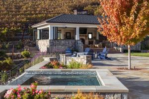 zero edge pool with reflection of vineyard