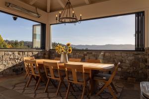 indoor/outdoor cooking and dining space with retractable windows  on all sides