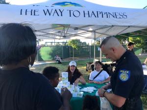 1)	Community members received The Way to Happiness booklets at National Night out in Pasa Robla Park.