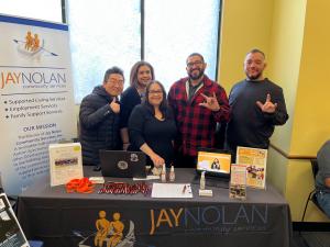 A group of Jay Nolan Community Services Employees at a job and resource fair