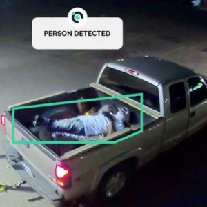 Masked criminal detected while laying in the back of a pickup truck. Proactive detection from Camect prevented a crime.