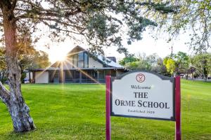 The Orme School Campus welcome sign and Founders Dining Hall
