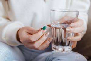 Woman taking pill