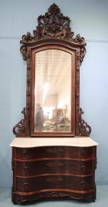 Mitchell and Rammelsberg Victorian dresser with serpentine front, white marble top, birds and grapes carved in crown, 10 feet 4 inches tall by 52 inches wide (est. $2,500-$5,000).