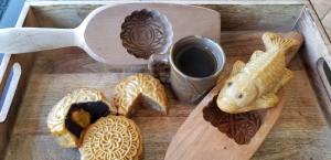 Mooncakes are made by hand using traditional wood molds with intricate patterns.